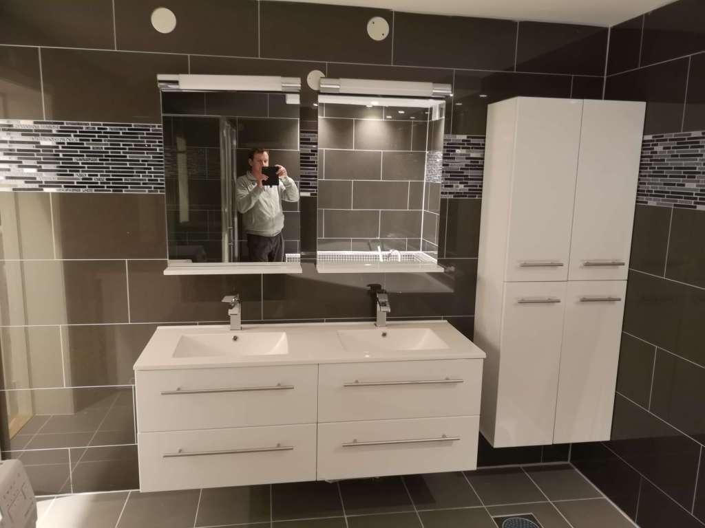 Image of a bathroom with sink and mirror