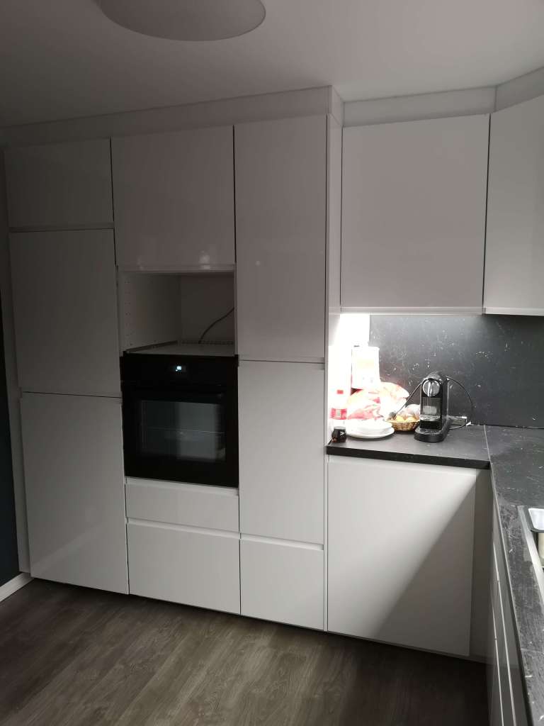 Image of a kitcken with white cabinets