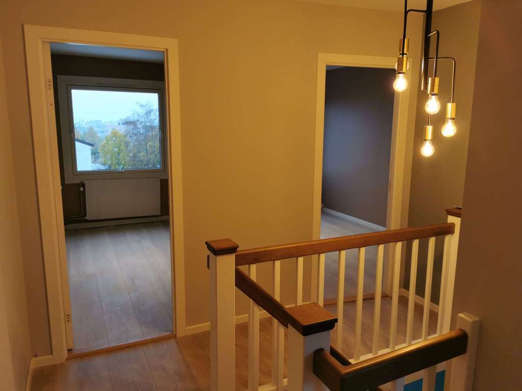 Image of a renovated room and a stair