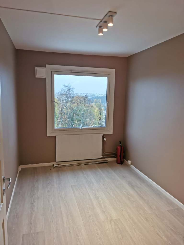 Image of a renovated room with a window