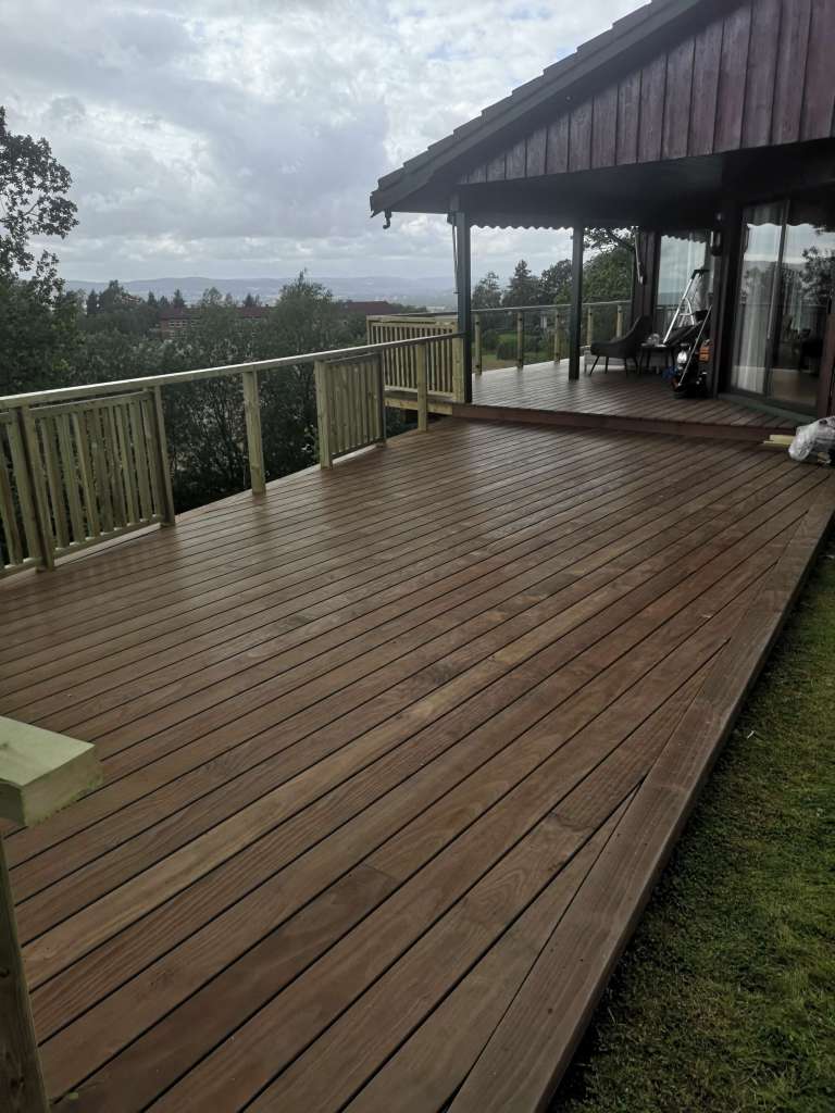 Image of a terrace, wooden railing and secured fence