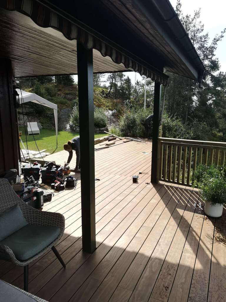 Image of a terrace, wooden railing and secured fence