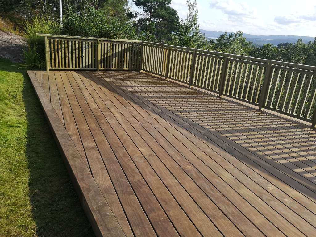 Image of a terrace, wooden railing and secured fence