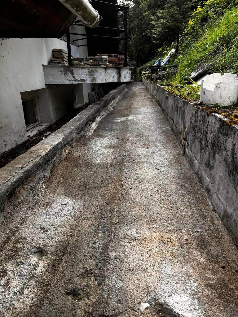 Image from behind a house ready for waterproofing with liquid membrane